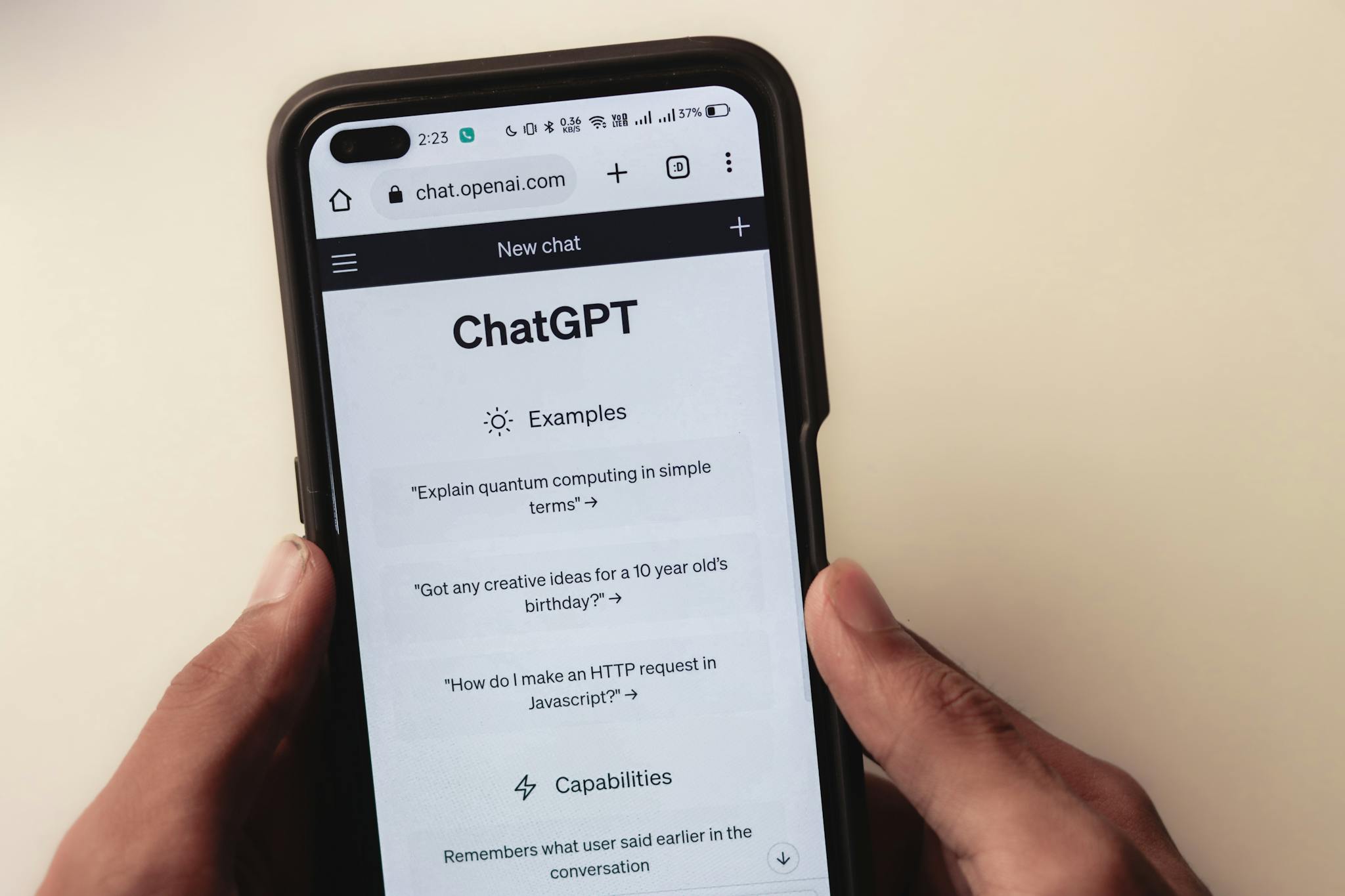 Close Up Of Hands Holding A Smartphone Displaying